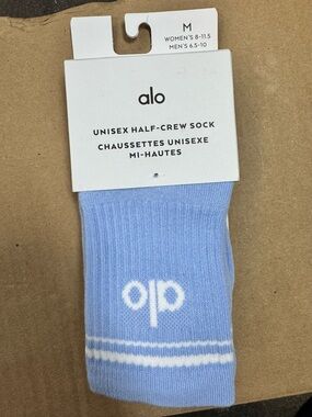 ALO Yoga Unisex Half-Crew Sock in Light Blue with White Logo